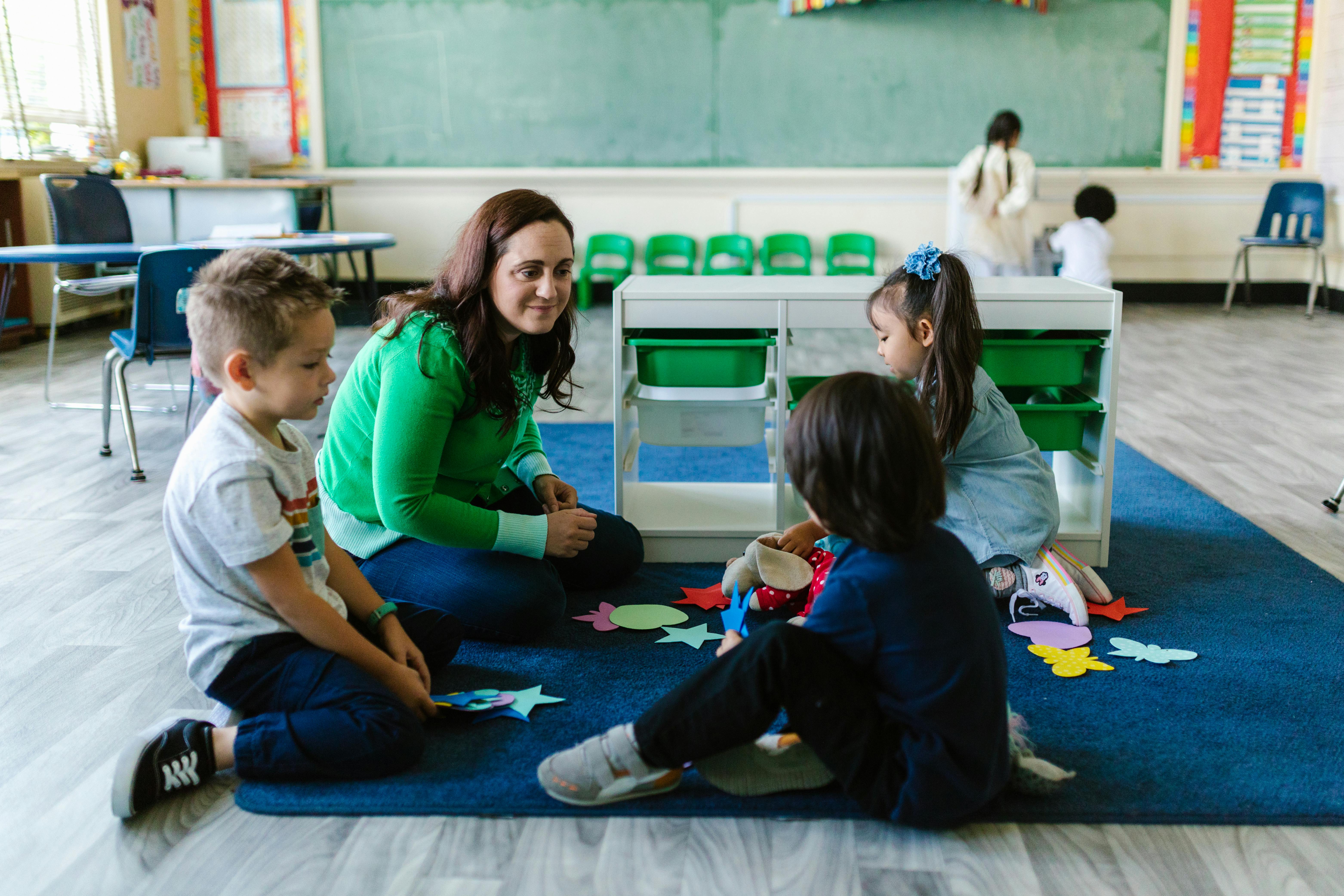 Teachers conducting a lesson with children in a daycare classroom